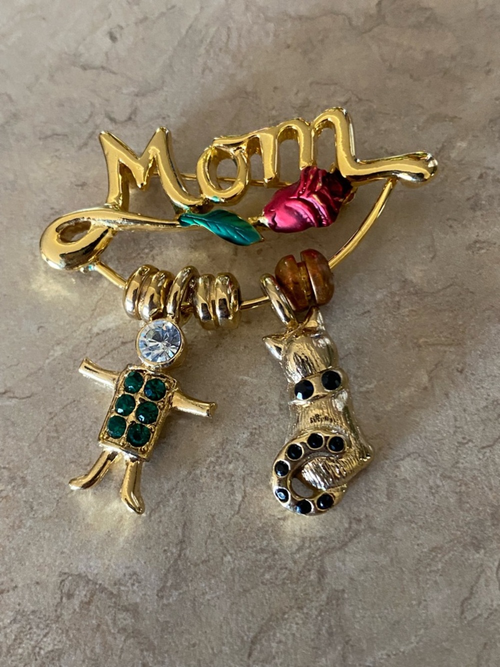 Vintage USA- Kis Mom Rose pin Brooch 
Dangling kid and cat.